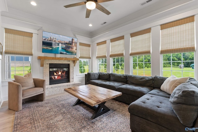 313 Merrydale Dr, Huntsville, AL 35811 - living room with ceiling fan, a glass covered fireplace, healthy amount of natural light, wood finished floors, and recessed lighting