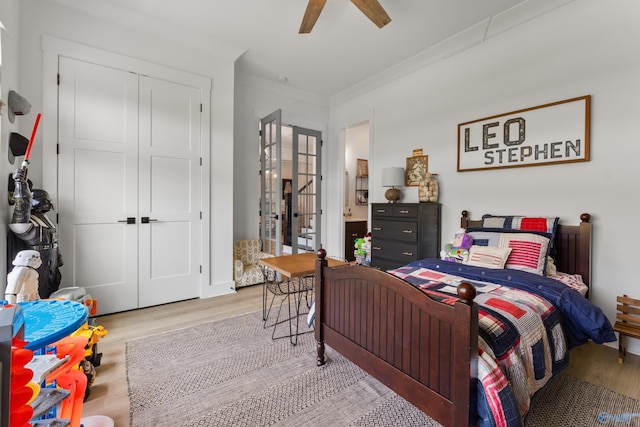 313 Merrydale Dr, Huntsville, AL 35811 - bedroom featuring wood finished floors, a closet, ornamental molding, and a ceiling fan