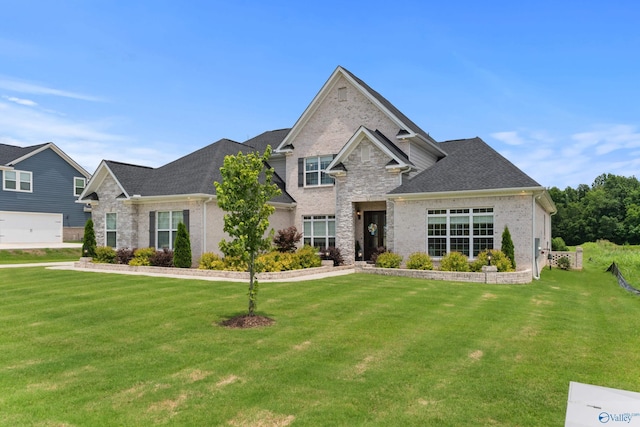 313 Merrydale Dr, Huntsville, AL 35811 - view of front facade with a front yard, brick siding, and roof with shingles