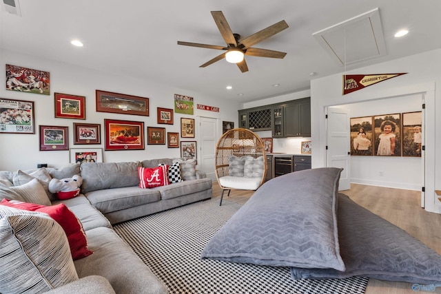 313 Merrydale Dr, Huntsville, AL 35811 - living area with attic access, a ceiling fan, wine cooler, light wood-style flooring, and bar area