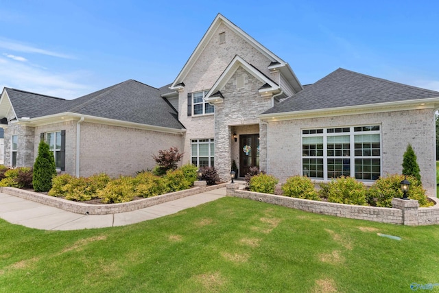 313 Merrydale Dr, Huntsville, AL 35811 - view of front facade with a front lawn, brick siding, and roof with shingles