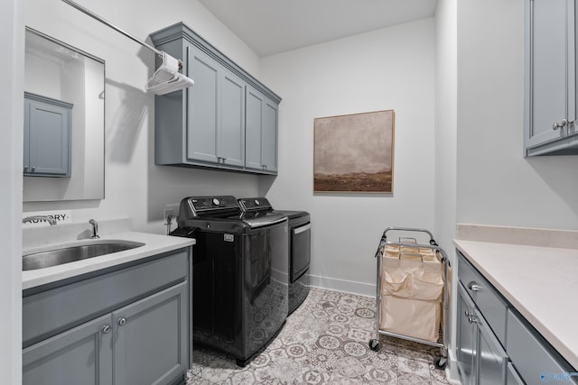 313 Merrydale Dr, Huntsville, AL 35811 - washroom featuring cabinet space, independent washer and dryer, and light tile patterned flooring