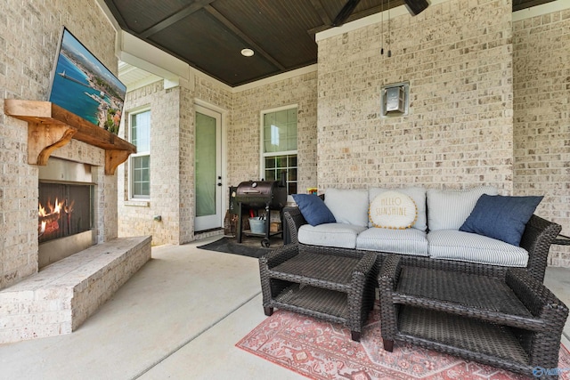 313 Merrydale Dr, Huntsville, AL 35811 - view of patio featuring area for grilling and an outdoor living space with a fireplace