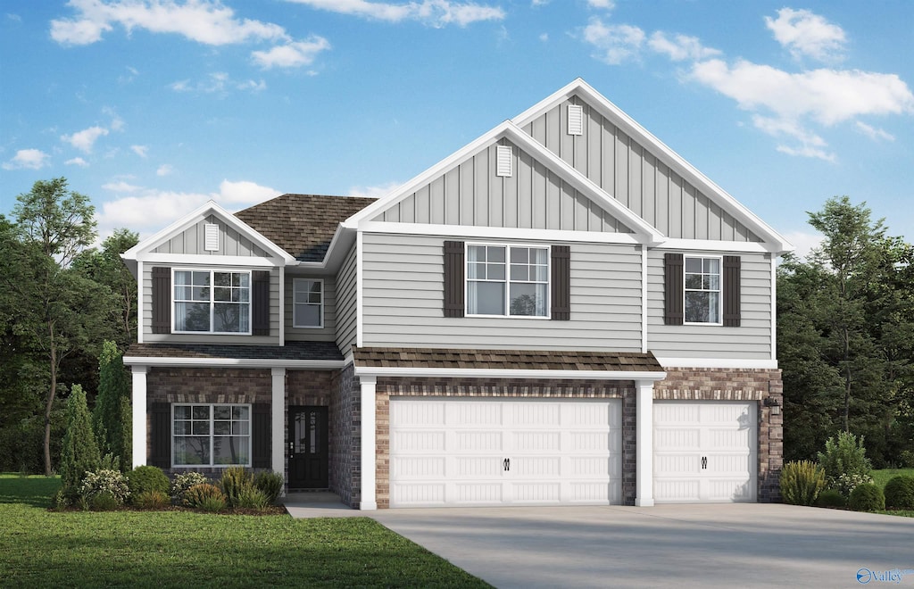 view of front of property featuring a garage and a front lawn