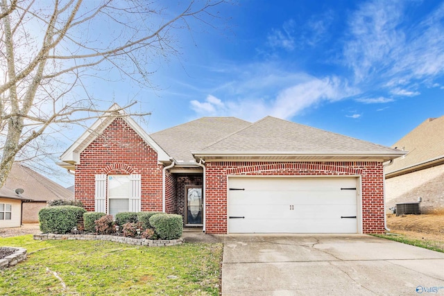 14335 Crooked Stick Pl, Athens, AL 35613 - view of front of house with cooling unit, a garage, and a front lawn