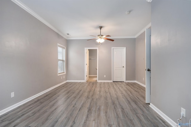 unfurnished room with ceiling fan, ornamental molding, and light hardwood / wood-style flooring