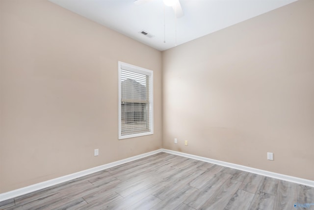 unfurnished room with ceiling fan and light wood-type flooring