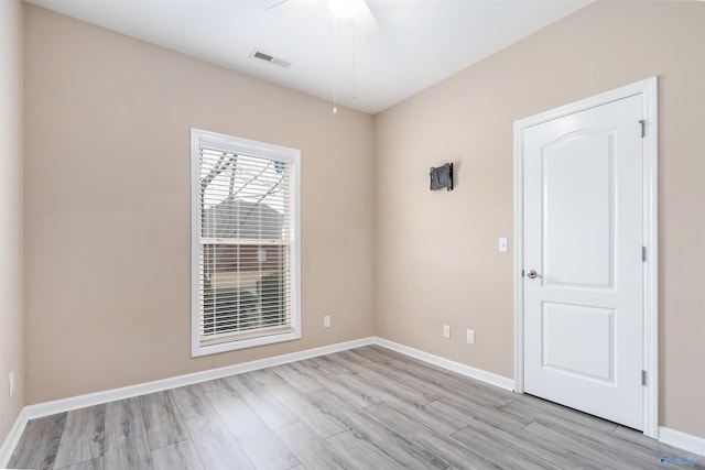 unfurnished room with ceiling fan and light hardwood / wood-style flooring