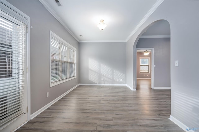 spare room with hardwood / wood-style flooring, ceiling fan, and ornamental molding