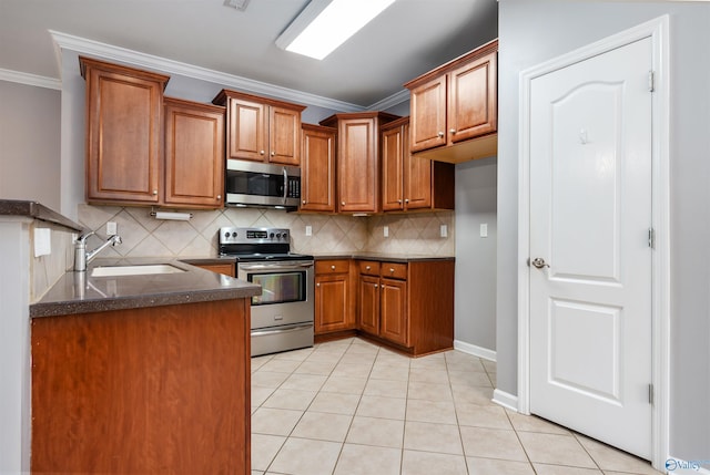 kitchen with sink, light tile patterned floors, ornamental molding, appliances with stainless steel finishes, and backsplash