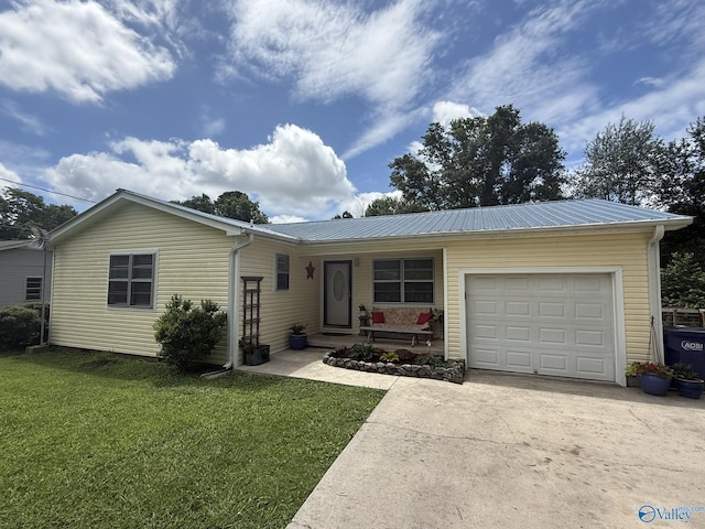 1128 Brashiers Chapel Rd, Arab, AL 35016 - ranch-style home with driveway, a garage, a front yard, and a metal roof