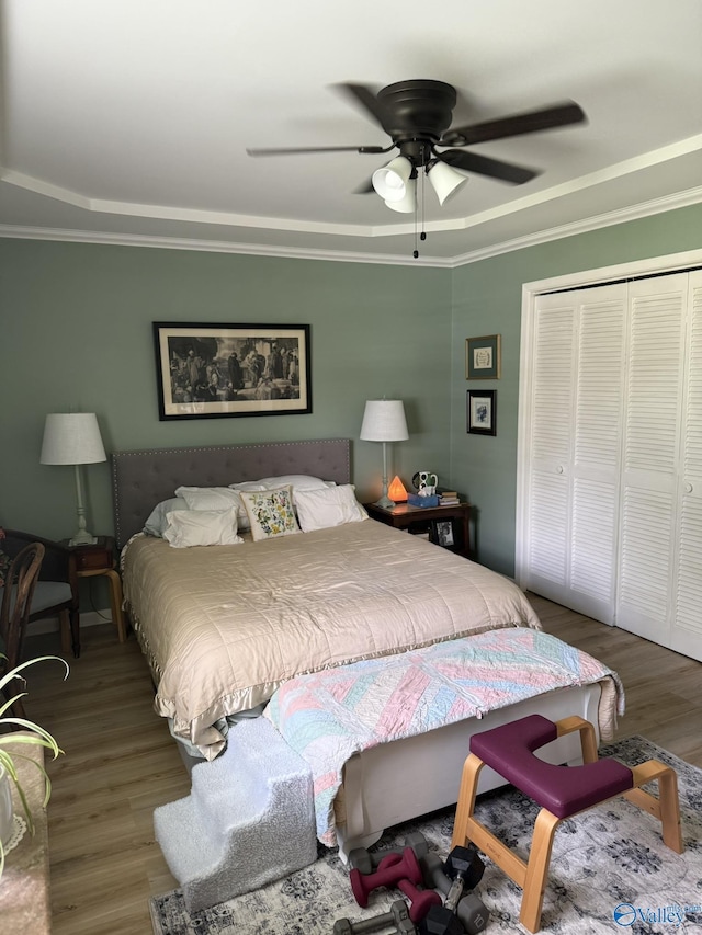 1128 Brashiers Chapel Rd, Arab, AL 35016 - bedroom featuring wood finished floors, ornamental molding, a closet, and ceiling fan