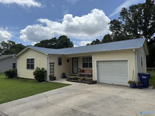 1128 Brashiers Chapel Rd, Arab, AL 35016 - ranch-style home featuring a garage, concrete driveway, a front yard, a metal roof, and a porch