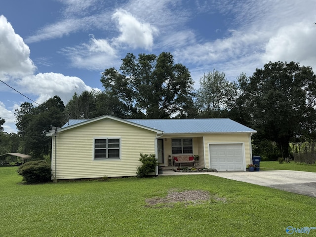 1128 Brashiers Chapel Rd, Arab, AL 35016 - view of front of property with an attached garage, a front yard, and a metal roof