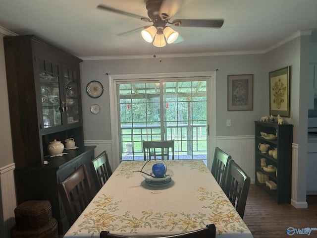 1128 Brashiers Chapel Rd, Arab, AL 35016 - dining area featuring wainscoting, ceiling fan, dark wood-type flooring, and crown molding