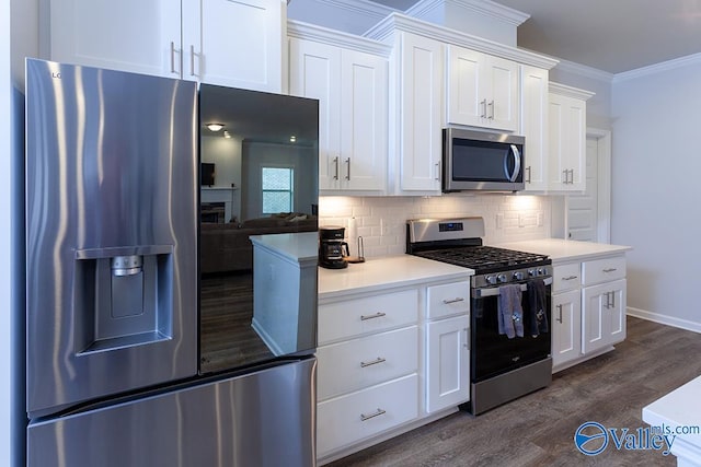 kitchen featuring white cabinets, crown molding, appliances with stainless steel finishes, tasteful backsplash, and dark hardwood / wood-style flooring