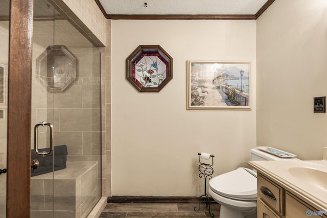 bathroom with a textured ceiling, vanity, toilet, and a shower with door