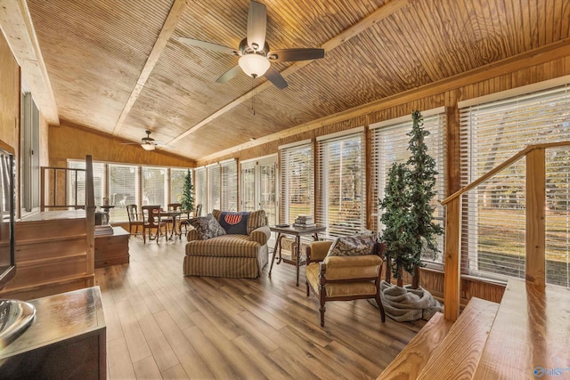 sunroom / solarium featuring ceiling fan, wooden ceiling, and vaulted ceiling