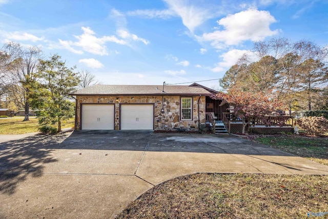 view of front of home with a garage and a wooden deck