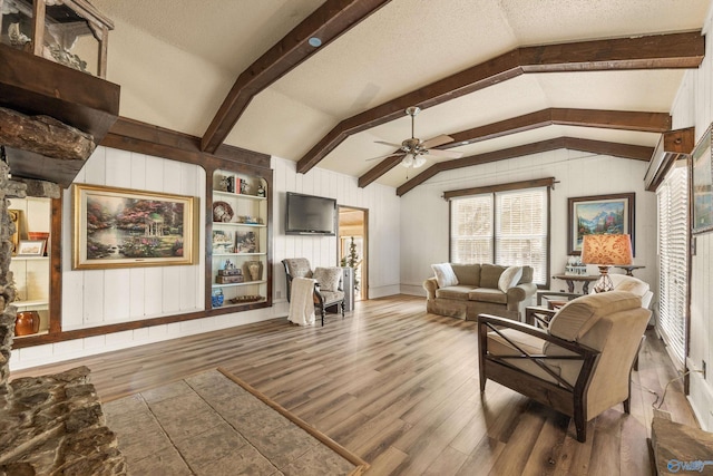 17835 Oakdale Rd, Athens, AL 35613 - living room with a ceiling fan, a healthy amount of sunlight, vaulted ceiling with beams, and wood finished floors