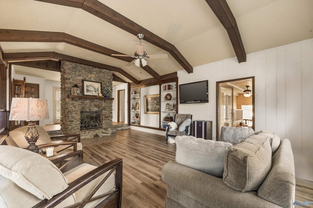 17835 Oakdale Rd, Athens, AL 35613 - living room featuring vaulted ceiling with beams, hardwood / wood-style flooring, a stone fireplace, and ceiling fan