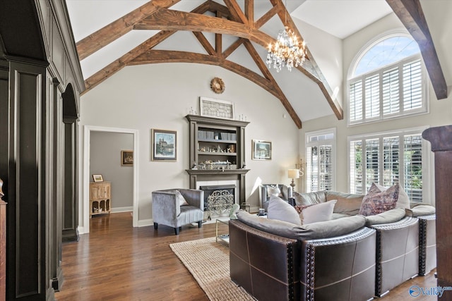 living room with beam ceiling, a notable chandelier, dark hardwood / wood-style floors, and high vaulted ceiling