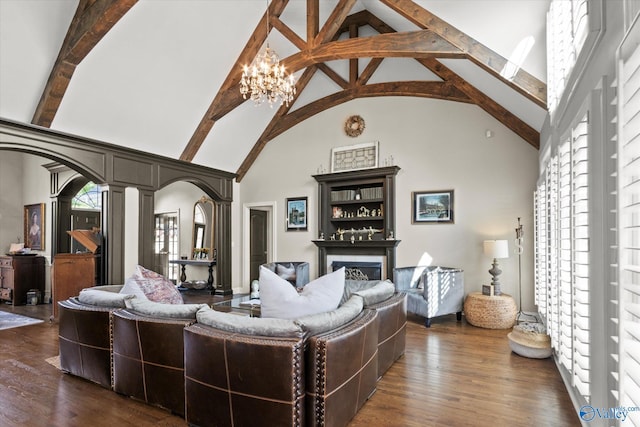 4716 Slalom Run SE, Owens Cross Roads, AL 35763 - living room with arched walkways, a fireplace, high vaulted ceiling, beamed ceiling, and dark wood-type flooring