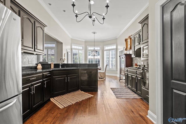 kitchen with stainless steel refrigerator, dishwasher, dark wood-type flooring, crown molding, and sink