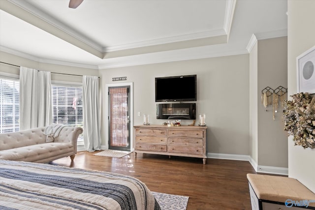 4716 Slalom Run SE, Owens Cross Roads, AL 35763 - bedroom with baseboards, ornamental molding, a raised ceiling, and dark wood-style flooring