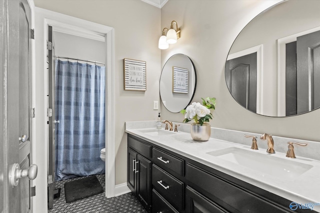 4716 Slalom Run SE, Owens Cross Roads, AL 35763 - bathroom with double vanity, a sink, tile patterned floors, and toilet