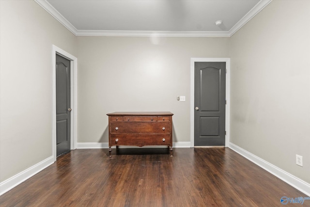 unfurnished room with ornamental molding and dark hardwood / wood-style floors