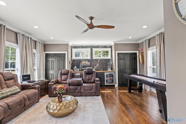 4716 Slalom Run SE, Owens Cross Roads, AL 35763 - living area featuring crown molding, a dry bar, beverage cooler, recessed lighting, and dark wood-type flooring