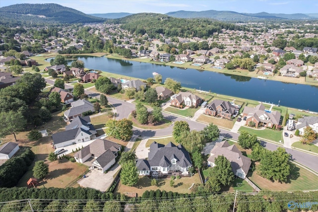 drone / aerial view featuring a water and mountain view