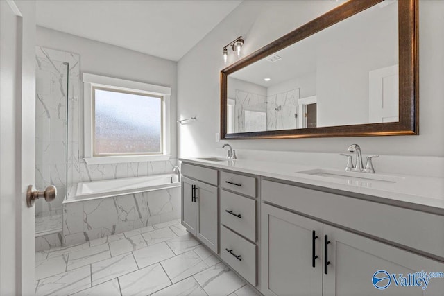 full bathroom featuring marble finish floor, a sink, a marble finish shower, and a bath