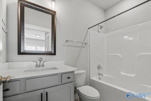 bathroom featuring shower / tub combination, vanity, and toilet