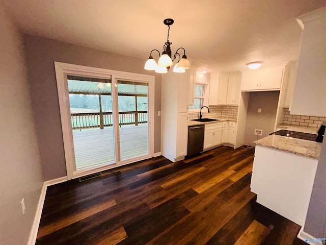 kitchen featuring light stone counters, backsplash, pendant lighting, white cabinets, and dishwasher