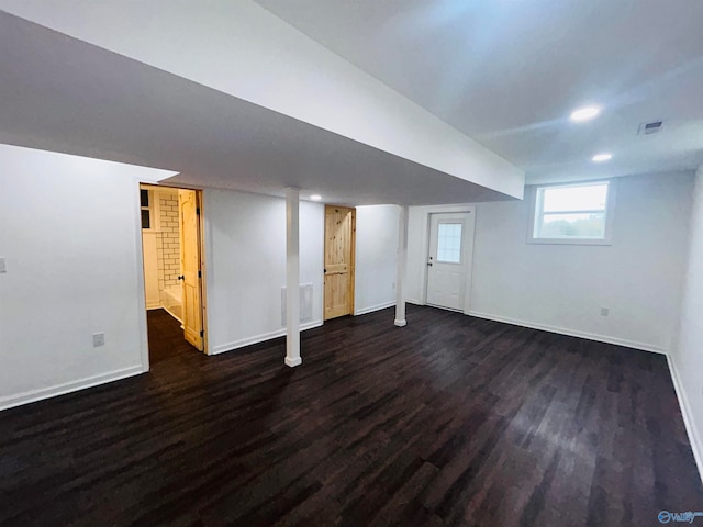 basement with dark wood-type flooring