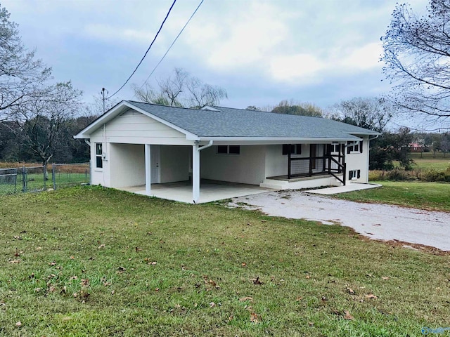 rear view of property with a patio and a yard