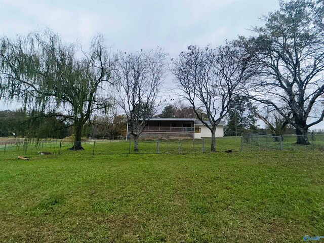 view of yard with a rural view