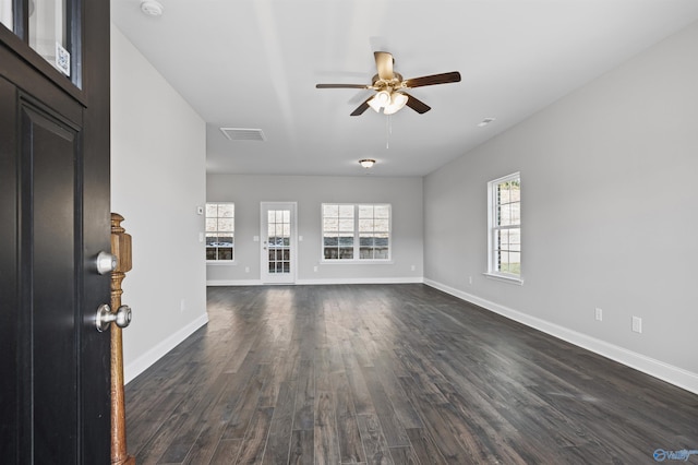 interior space featuring dark wood-type flooring and ceiling fan