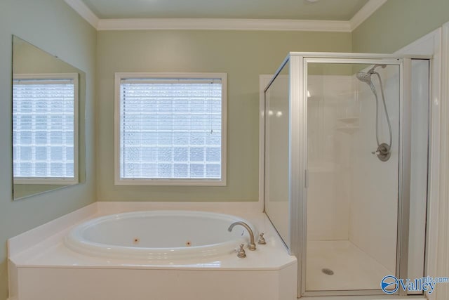 bathroom with a healthy amount of sunlight, crown molding, and independent shower and bath