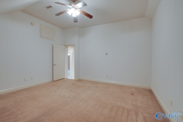 carpeted empty room with ceiling fan and lofted ceiling