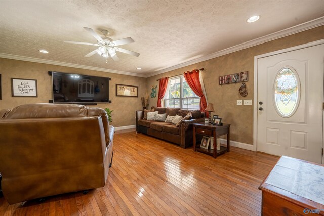 living room with light hardwood / wood-style flooring and ornamental molding