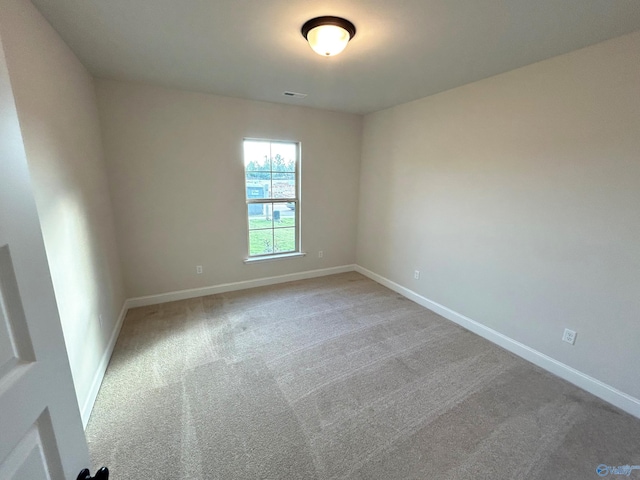 unfurnished room with carpet flooring