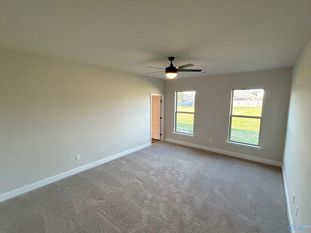 carpeted empty room with ceiling fan