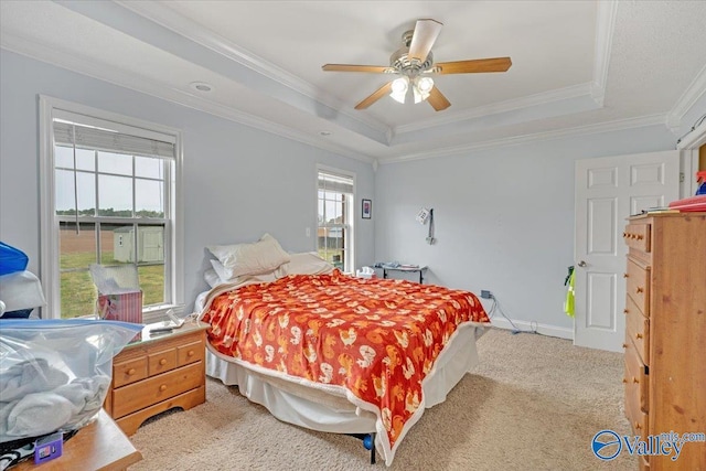 23311 Toone Rd, Elkmont, AL 35620 - bedroom with baseboards, ornamental molding, a ceiling fan, light carpet, and a raised ceiling