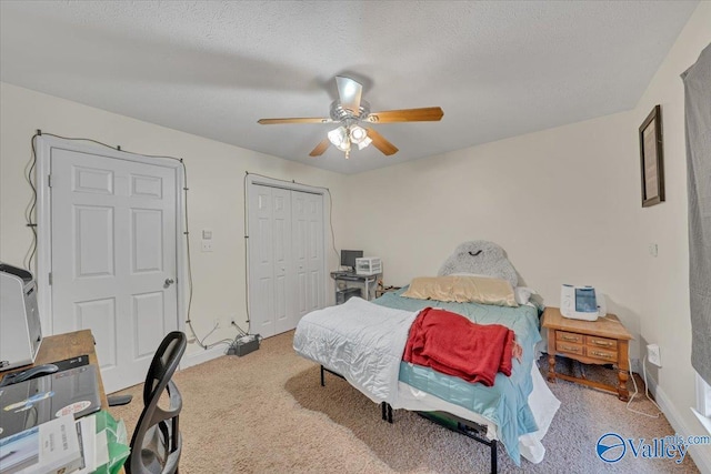 23311 Toone Rd, Elkmont, AL 35620 - carpeted bedroom featuring a closet, a textured ceiling, baseboards, and ceiling fan