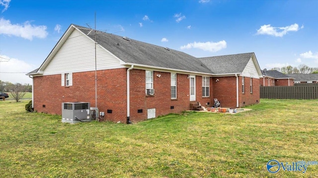 23311 Toone Rd, Elkmont, AL 35620 - rear view of property featuring brick siding, crawl space, central AC unit, and a lawn