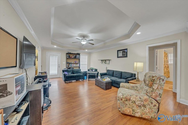 23311 Toone Rd, Elkmont, AL 35620 - living area with a tray ceiling, recessed lighting, ornamental molding, light wood finished floors, and ceiling fan