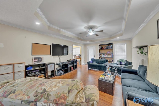 23311 Toone Rd, Elkmont, AL 35620 - bedroom featuring ornamental molding, a tray ceiling, multiple windows, and wood finished floors